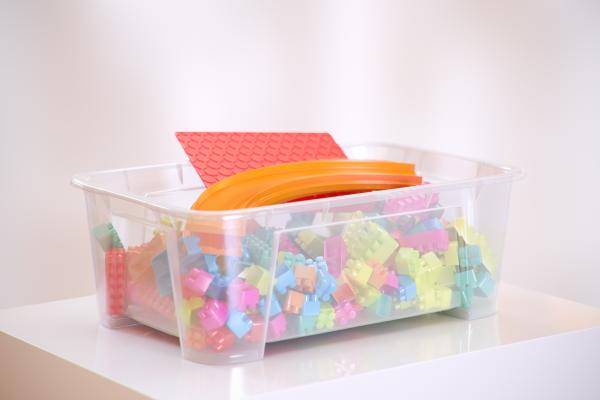Box of colorful plastic toy blocks